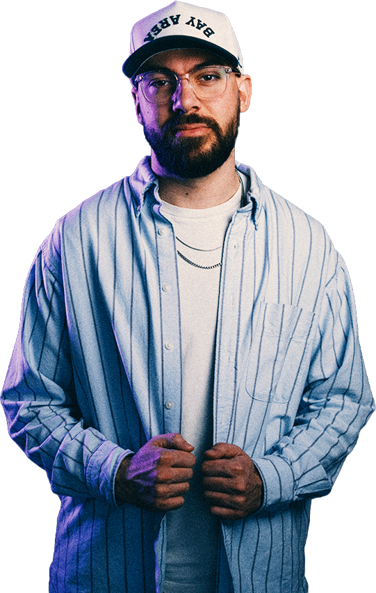Christian smiling in a striped shirt and cap